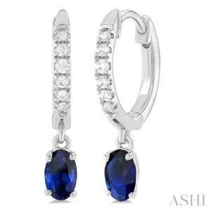 1/8 ctw Petite 5X3MM Oval Cut Sapphire and Round Cut Diamond Precious Fashion Huggies in 10K White Gold