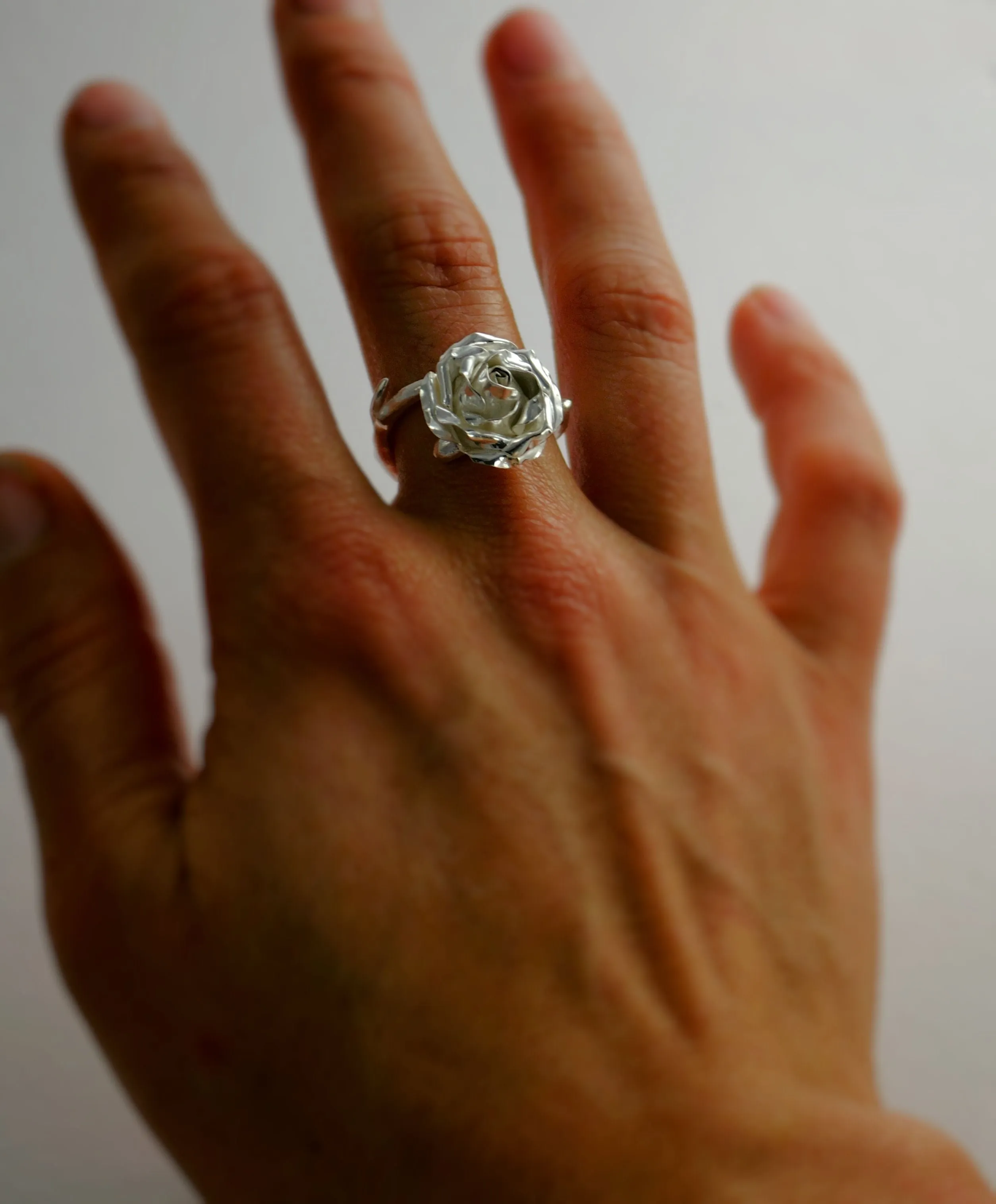 Large cocktail rose ring with a soft rose stem made in sterling silver