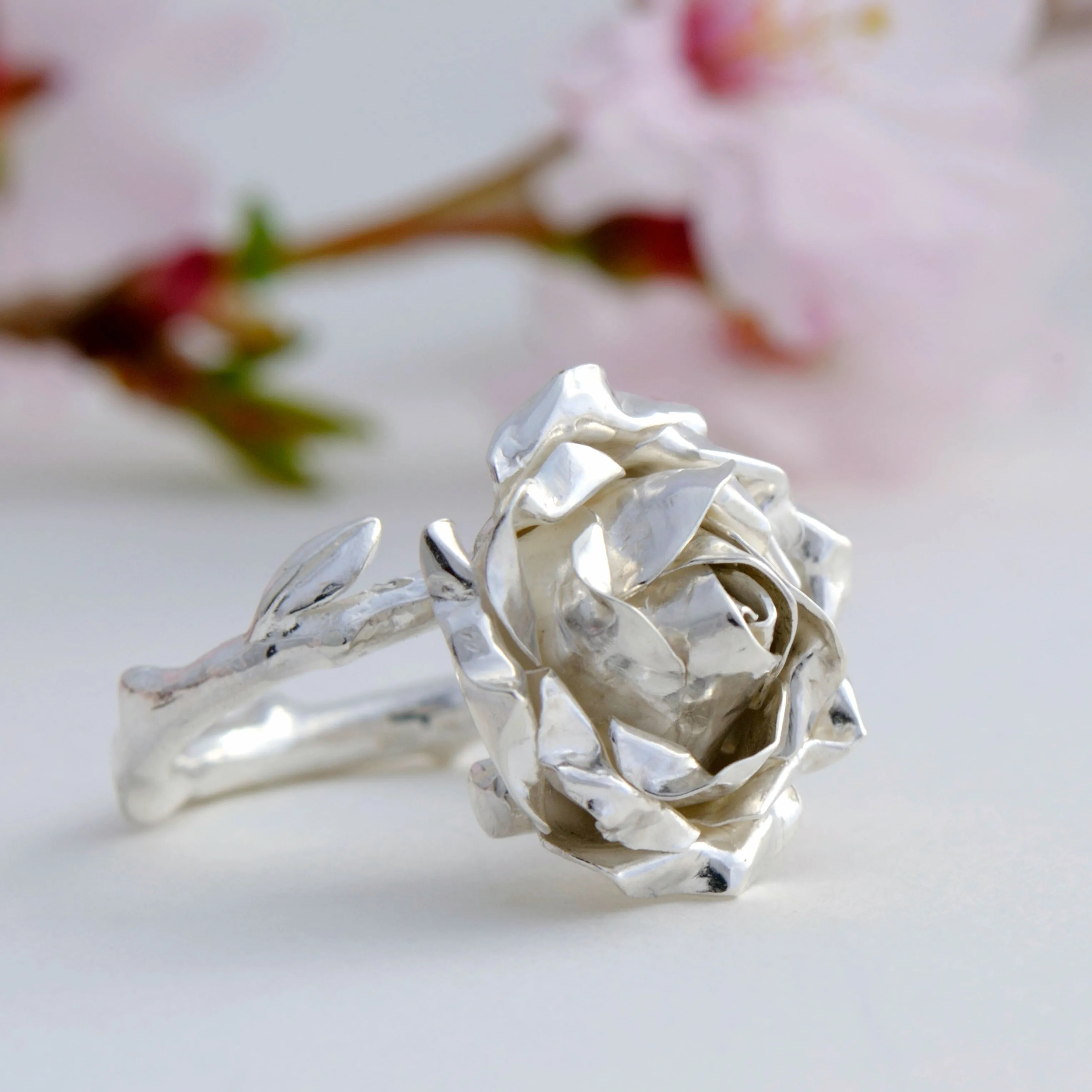 Large cocktail rose ring with a soft rose stem made in sterling silver